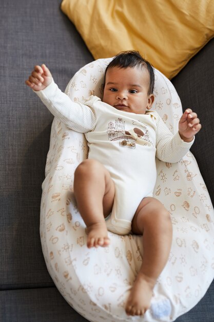 Happy baby boy in cute bodysuit