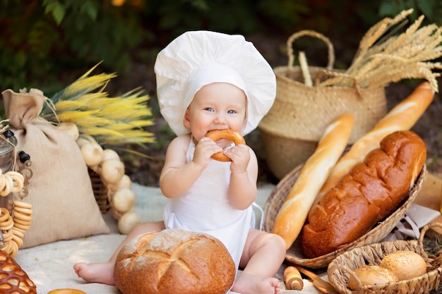 Happy baby boy getting ready in nature on a sunny summer day