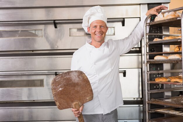 Happy baker smiling at camera