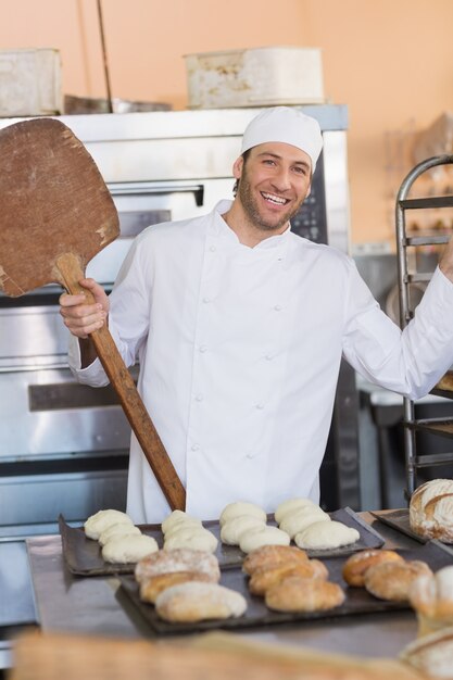 Happy baker smiling at camera