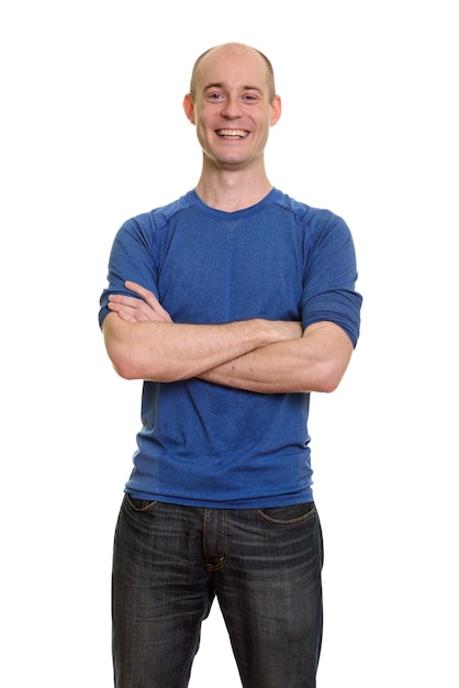 Happy bald Caucasian man smiling with arms crossed