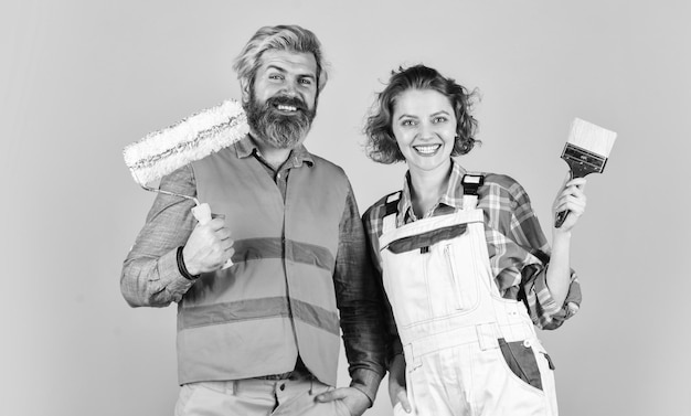 Happy to be here Portrait of confident handyman and his female colleague follow repairing steps wear