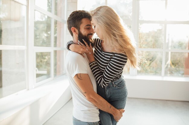 Happy to be together Handsome young man piggybacking beautiful woman and smiling