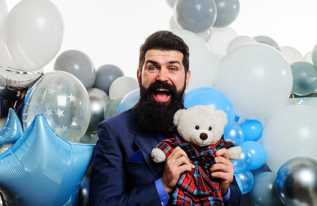 Happy bearded businessman in suit with teddy bear festive event handsome man celebrate birthday