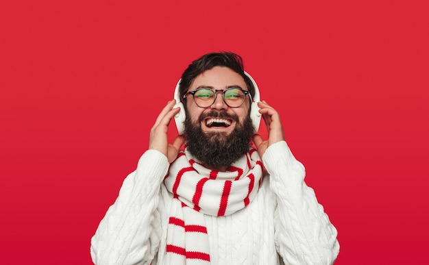 Happy bearded guy laughing and enjoying good music