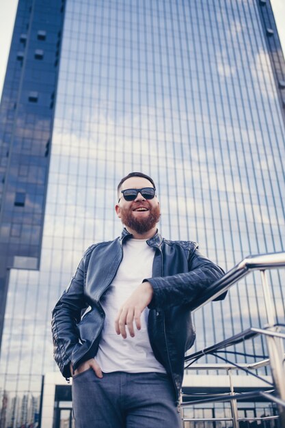 Happy bearded man in a leather jacket