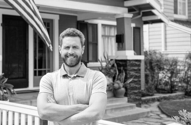 Happy bearded man realtor selling or renting house copy space property