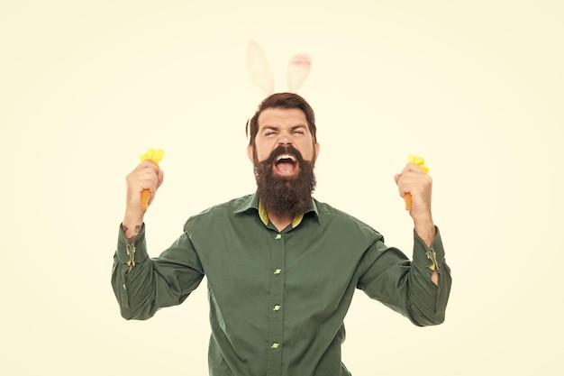 Happy bearded man wear funny bunny ears on easter holiday hold painted eggs happy easter