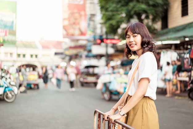 Happy and Beautiful Asian woman traveling at Khao Sarn Road, Thailand