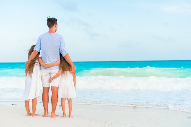 Happy beautiful family on a tropical beach vacation