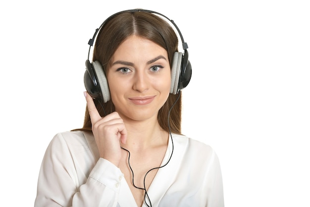 Happy beautiful girl listening  music in headphones.