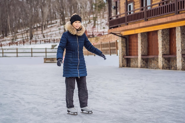 Happy beautiful girl wearing warm winter clothes ice skating