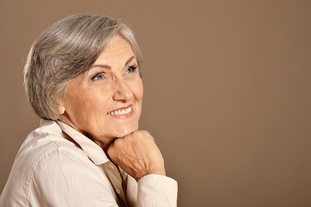 Happy beautiful smiling senior woman posing