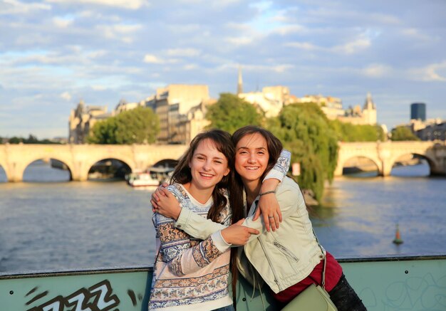 Happy beautiful student girls in Paris