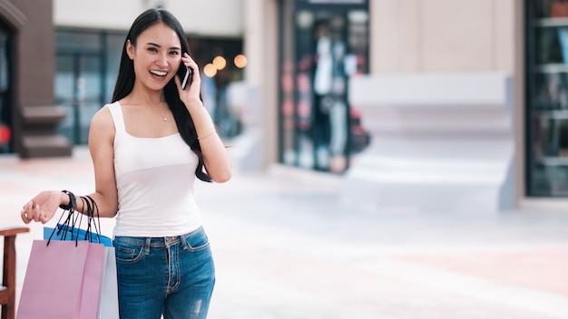 Happy beautiful  woman enjoying in shopping.