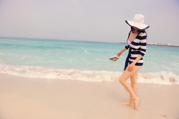 Happy Beautiful Woman Enjoying Summer Vacation on beach