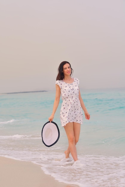 Happy Beautiful Woman Enjoying Summer Vacation on beach