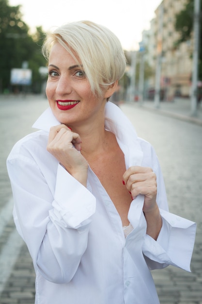 Happy beautiful woman in white shirt with various emotions close-up portrait