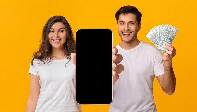 Photo happy beautiful young couple enjoying prize gambling online mockup