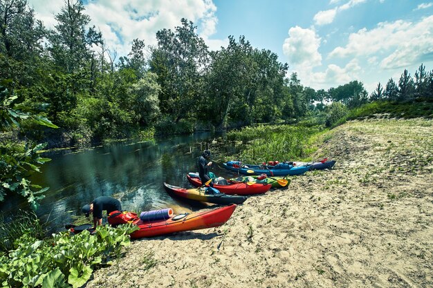 Happy best friends having fun on a kayaks. Kayaking on the river.