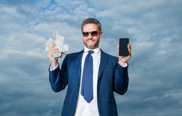 Happy betting man with lottery money on sky background betting man with lottery money