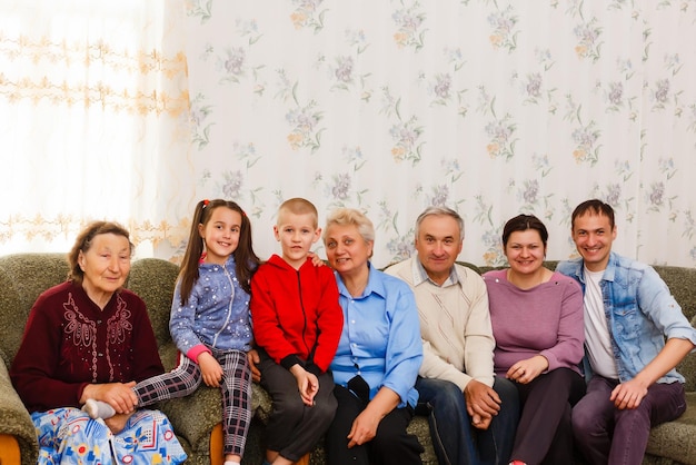 Photo happy big family on the sofa at home