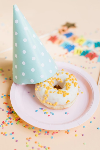 Happy birthday donut on pink plate