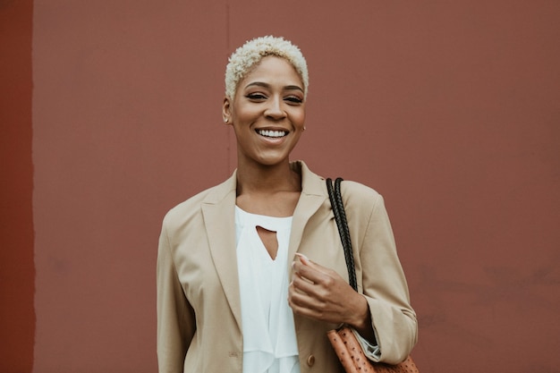 Happy black businesswoman strolling the streets