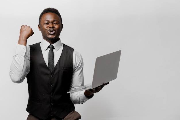 Happy black man wins some money in on-line lottery