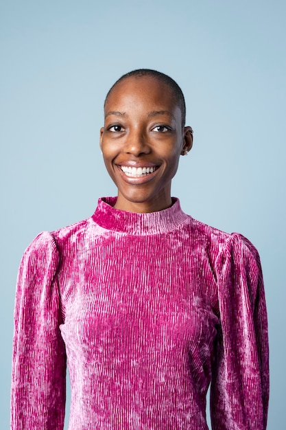 Happy black woman in a pink dress