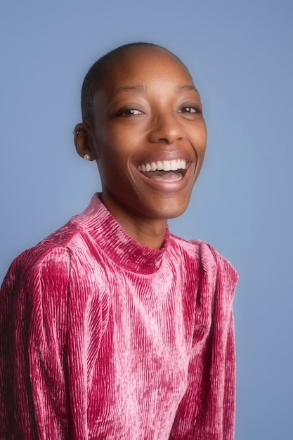 Happy black woman in a pink dress