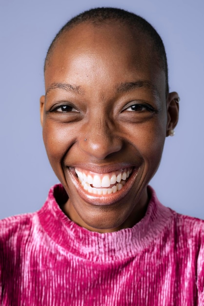 Happy black woman in a pink dress