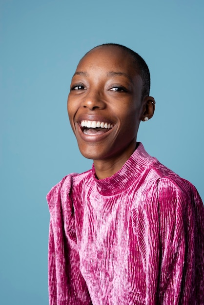 Happy black woman in a pink dress