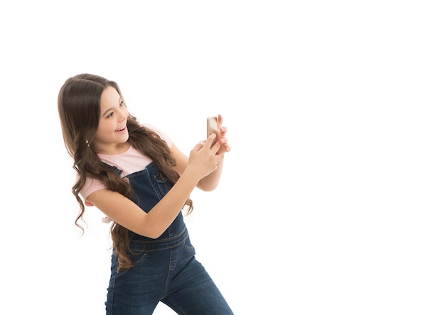 Happy blogging teen girl in studio photo of teen girl blogging teen girl blogging