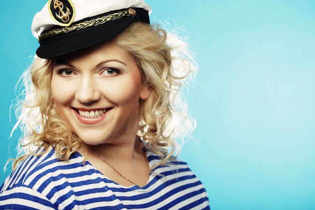 Happy blond woman on blue background