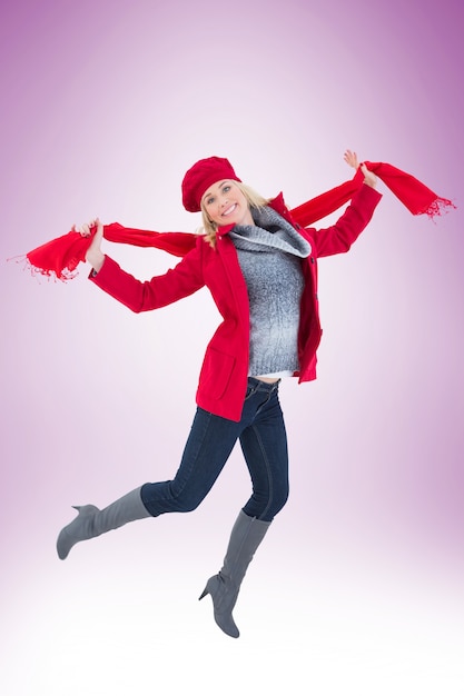 Happy blonde in winter clothes posing