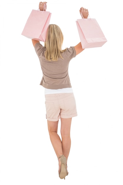 Happy blonde with shopping bags