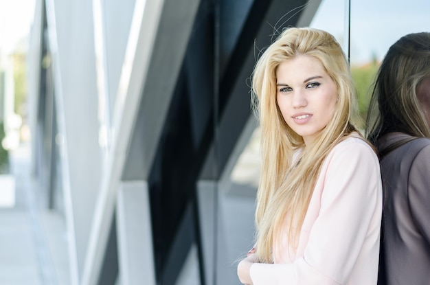 Happy blonde young woman smiling isolated