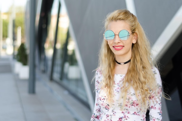 Happy blonde young woman smiling isolated