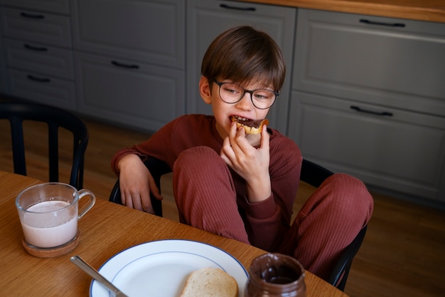 Happy boy eating sweets on chocolate day