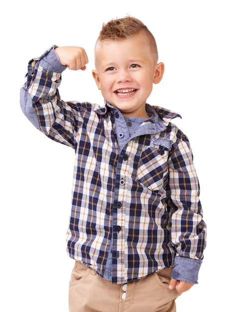 Foto figlio felice flessibile e alla moda con capelli e camicia a scacchi in piedi isolato su uno sfondo bianco di studio il viso di un bambino piccolo bambino o persona maschile sorriso che mostra muscoli in abbigliamento casual