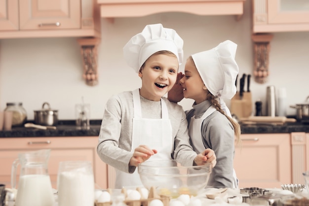 Happy Boy and Girl Cook Together at Home Kitchen