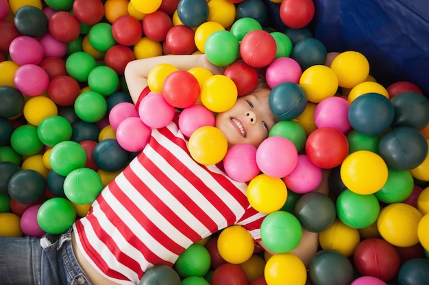 Happy boy playing in ball pool 