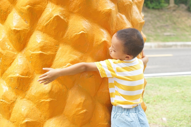 Happy boy playing in the park