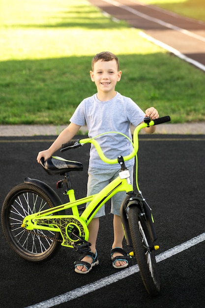 happy boy with bright bike, learning, active lifestyle