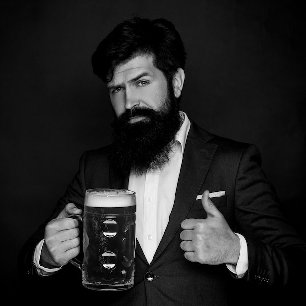 Happy brewer Bearded man with a glass of beer Beer in the UK Happy smiling man with beer Happy brewe