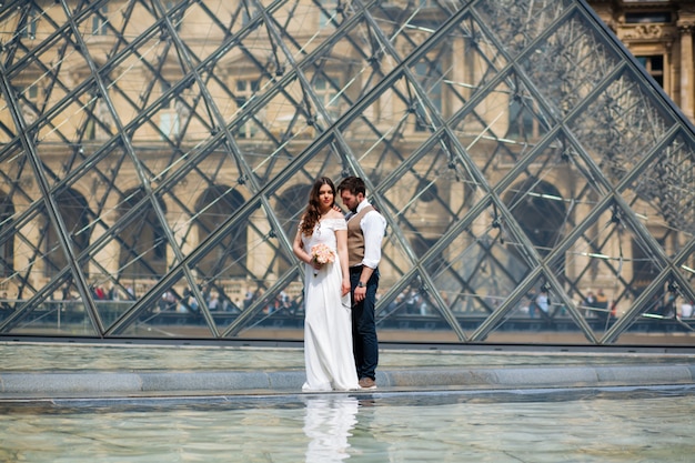 Happy bride and groom enjoying their wedding in Paris