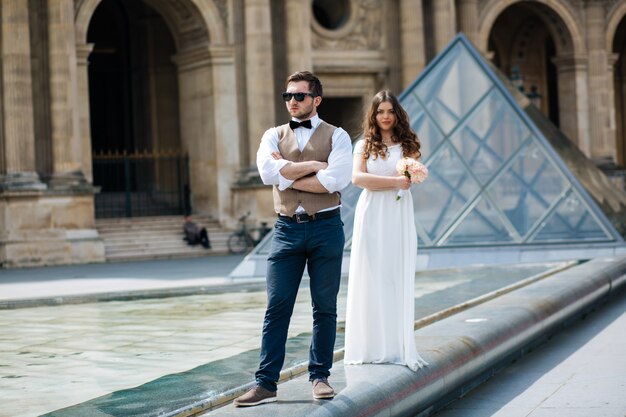 Happy bride and groom enjoying their wedding in Paris