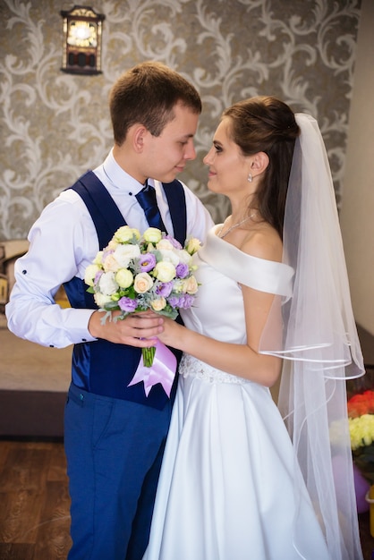 happy bride and groom at home on wedding day