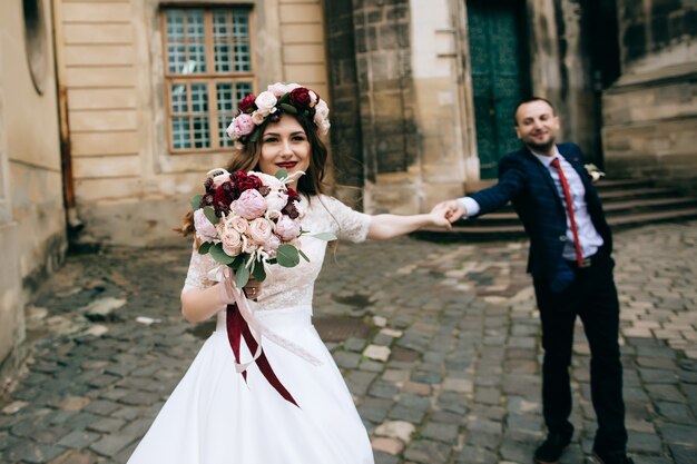 Happy bride and groom on the streets of the old city